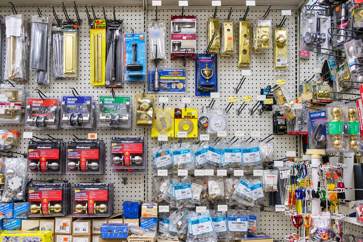 Door locks, levers, and door hardware on the pegboard wall at S&V Hardware